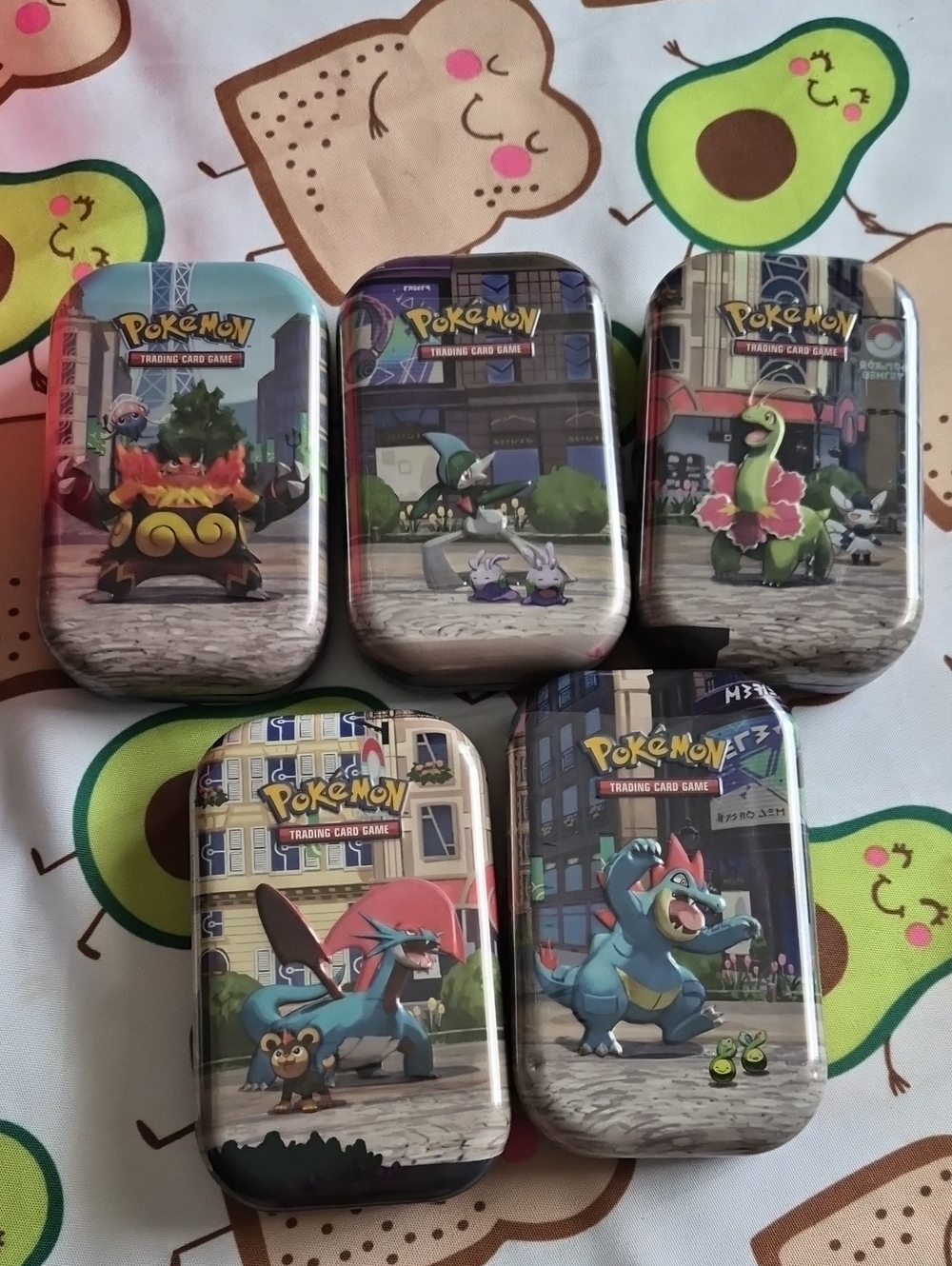 Pokemon Tin Set with Blue, Green, Red, Purple, Tan Artwork
